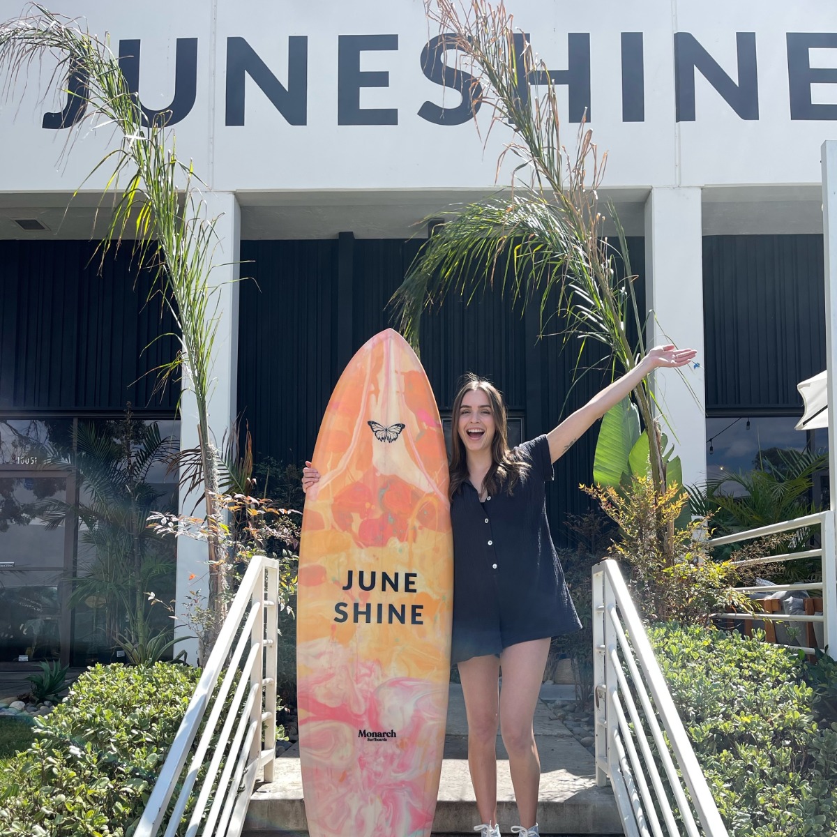 Girl with surf board at Juneshine
